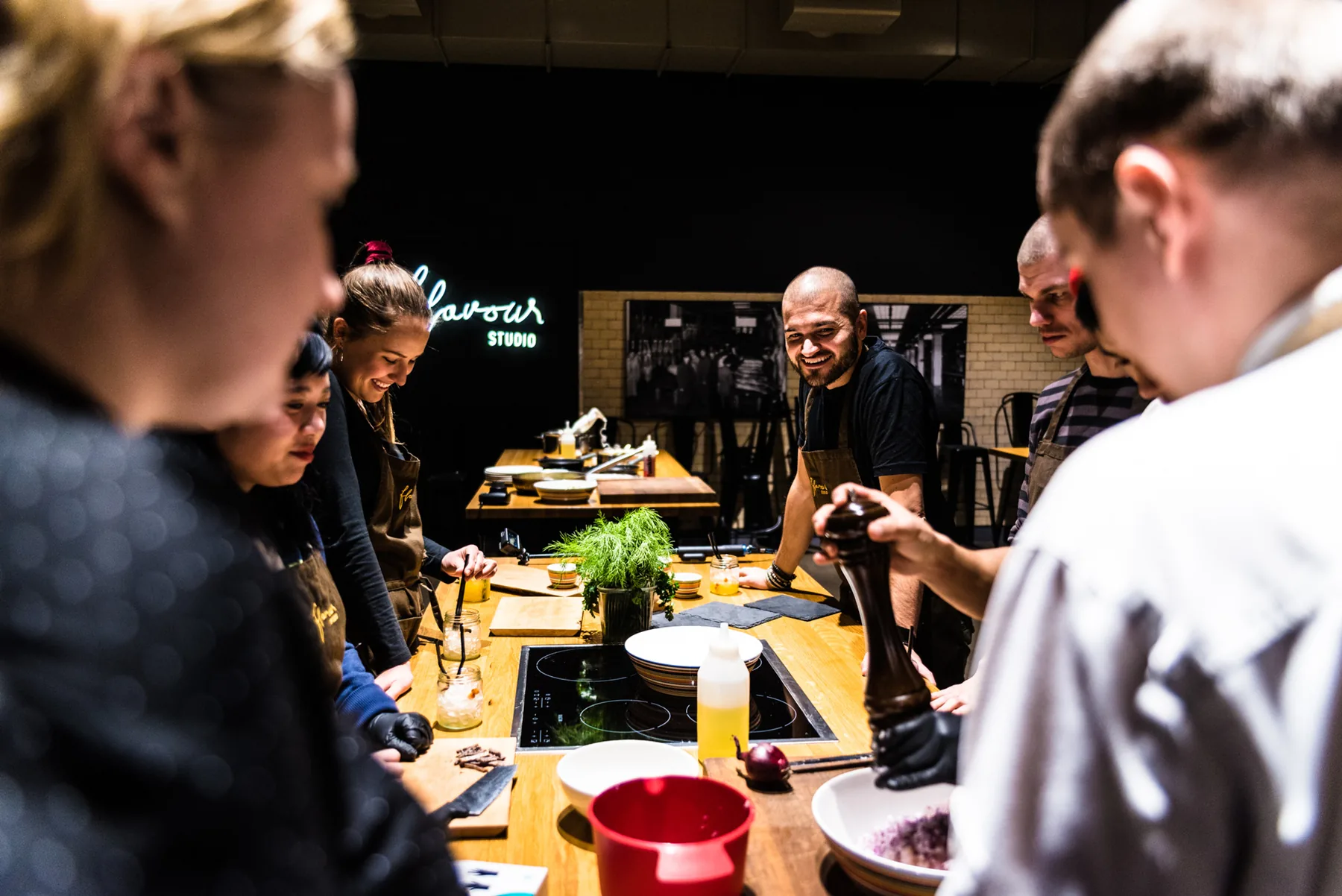 A team cooking together at a Flavour Studio station.
