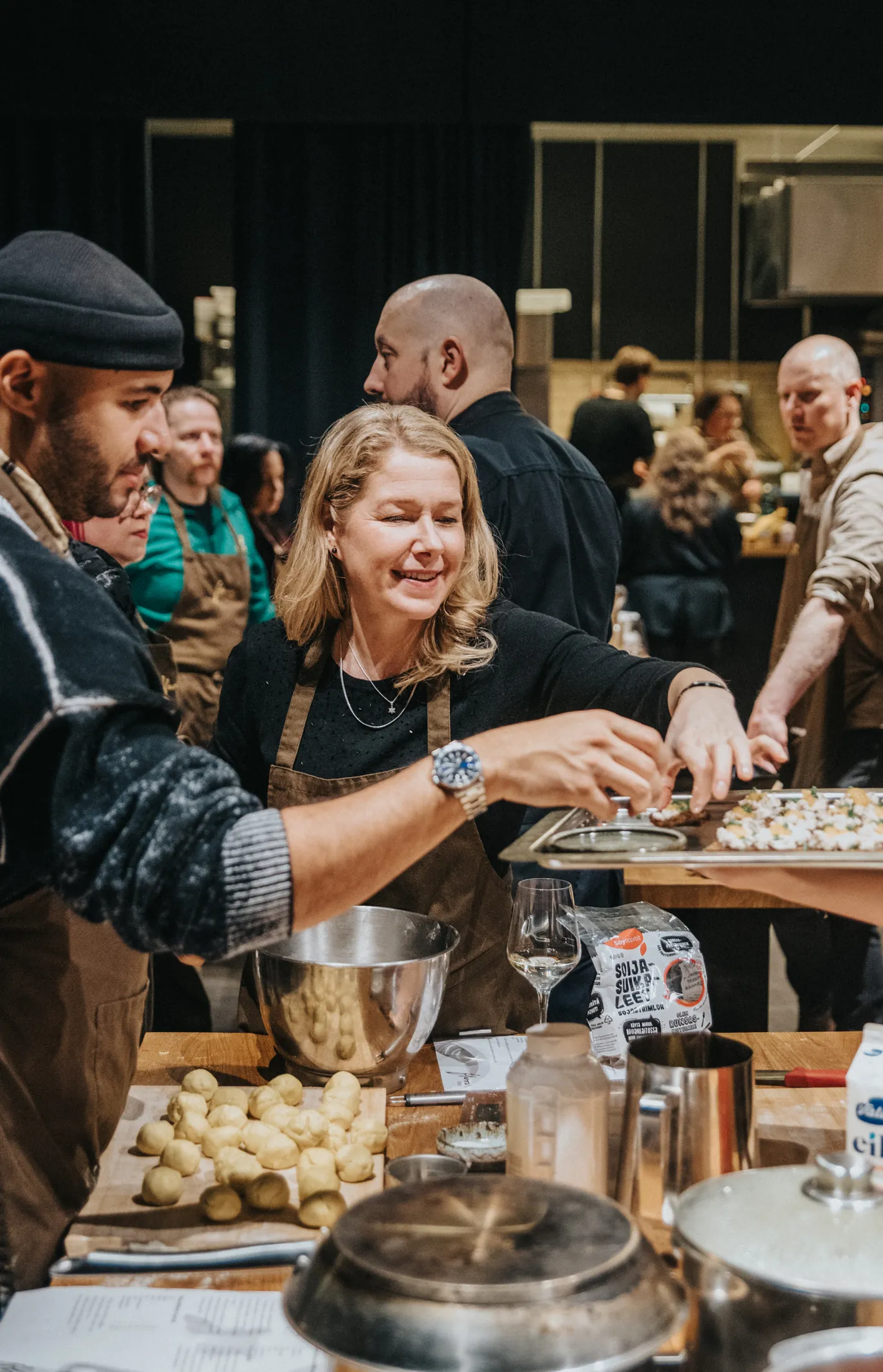 Guests making dough together.
